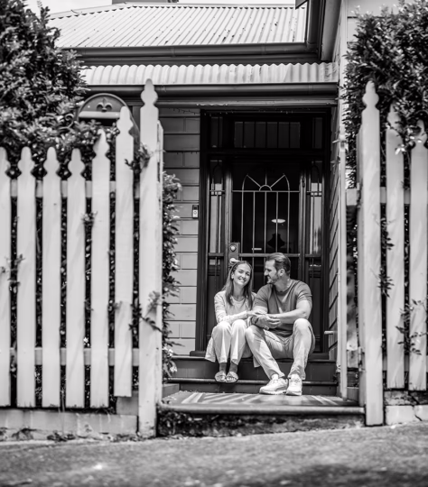 Couple in front of house